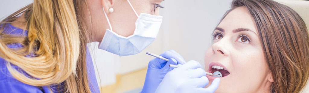 Dental patient having teeth examined at Four Rivers Community Health Center