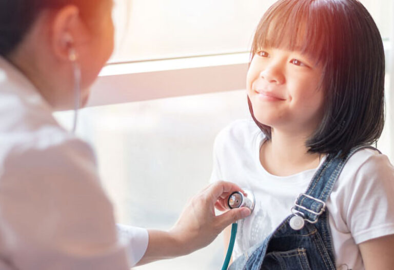 Little girl getting her heart checked. Pediatrics