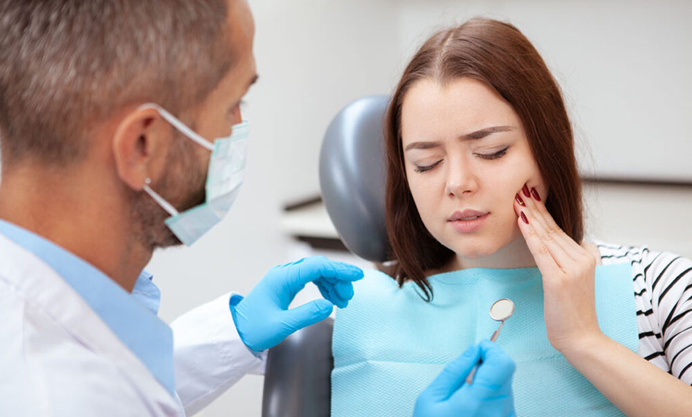 Beautiful young woman visiting dentist for medical checkup