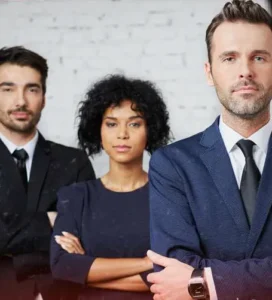 Three People. Two men in suits and women in business attire.